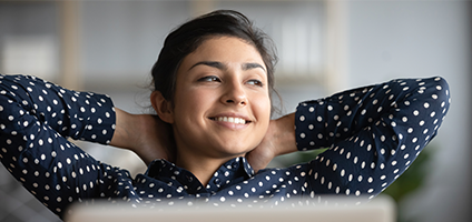 Woman leaning back in her chair