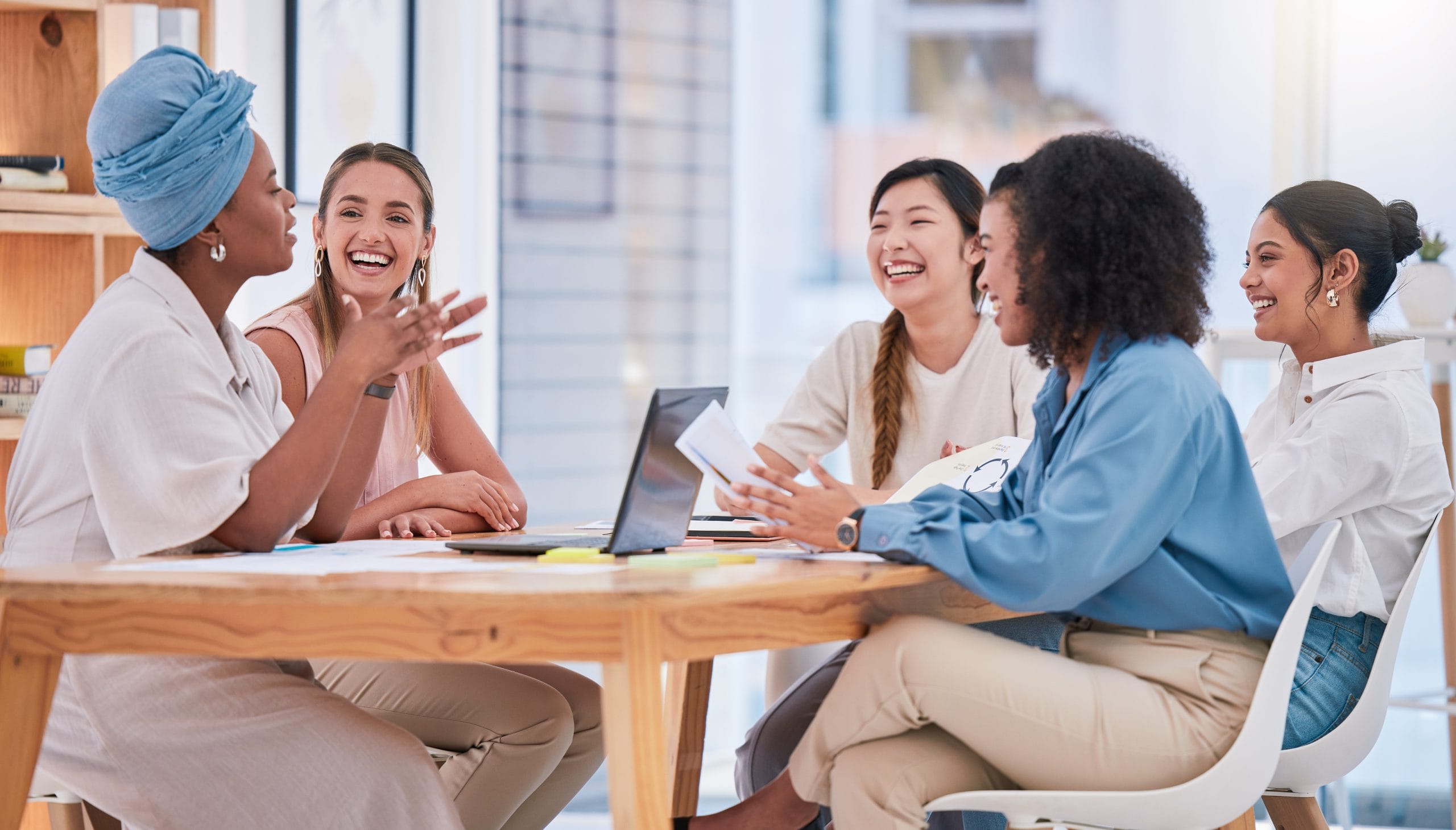 Group of female teammates working together