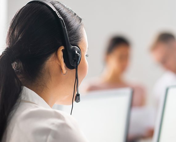 Woman in call center with headset